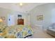 Comfortable bedroom with blue walls and floral bedding, offering a peaceful retreat with matching furnishings at 1250 Camlet Ln., Little River, SC 29566