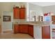 Efficient kitchen with ample cabinet space and a breakfast bar overlooking the dining area and living room at 1250 Camlet Ln., Little River, SC 29566