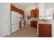 Galley kitchen features modern appliances and a tile floor with lots of counter space and cabinet storage at 1250 Camlet Ln., Little River, SC 29566