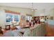 Bright and airy living room with vaulted ceilings, multiple windows and hardwood flooring throughout at 1250 Camlet Ln., Little River, SC 29566