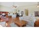 Open concept living room featuring hardwood flooring and vaulted ceilings with views into the dining area at 1250 Camlet Ln., Little River, SC 29566