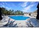 Community pool area with lounge chairs, shade umbrellas, and a well-maintained pool at 1250 Camlet Ln., Little River, SC 29566