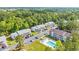 Aerial view of condos surrounded by beautiful green landscaping, pool, and parking areas at 1260 White Tree Ln. # F, Myrtle Beach, SC 29588
