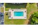 Aerial view of a pool, lounge chairs, with parking and a green lawn at 1260 White Tree Ln. # F, Myrtle Beach, SC 29588