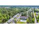 Aerial view of apartments with parking and a pool with lounge chairs surrounded by trees at 1260 White Tree Ln. # F, Myrtle Beach, SC 29588