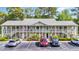 Inviting condo building with parking and lush landscaping, offering a serene living environment near the coast at 1260 White Tree Ln. # F, Myrtle Beach, SC 29588