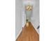 Hallway featuring wood floors and a modern chandelier at 1260 White Tree Ln. # F, Myrtle Beach, SC 29588