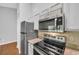 Modern kitchen with stainless steel appliances and light wooden countertops at 1260 White Tree Ln. # F, Myrtle Beach, SC 29588