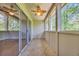 Relaxing screened porch with tiled flooring and a ceiling fan, perfect for enjoying the outdoors at 1260 White Tree Ln. # F, Myrtle Beach, SC 29588