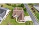 An aerial view shows the roofline of a tan home surrounded by lush green lawns at 127 Willow Bay Dr., Murrells Inlet, SC 29576