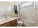 Comfortable bathroom featuring a shower over tub, a wooden vanity, and nautical decor at 127 Willow Bay Dr., Murrells Inlet, SC 29576
