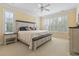 Bedroom with plush carpet, natural light, a ceiling fan, and a large comfortable bed at 127 Willow Bay Dr., Murrells Inlet, SC 29576