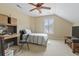 Comfortable bedroom featuring carpet, a wooden desk, a ceiling fan, and a window with shutters at 127 Willow Bay Dr., Murrells Inlet, SC 29576