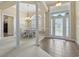 Bright foyer and dining room with decorative columns and high ceilings at 127 Willow Bay Dr., Murrells Inlet, SC 29576