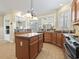 Well-equipped kitchen featuring an island and views into the breakfast area at 127 Willow Bay Dr., Murrells Inlet, SC 29576