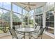 Bright sunroom featuring a ceiling fan and abundant natural light at 127 Willow Bay Dr., Murrells Inlet, SC 29576
