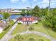 Stunning aerial view of a waterfront home featuring a red roof and lush landscaping at 128 Causey St., Myrtle Beach, SC 29577