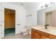 Bathroom featuring a white sink, toilet, and shower with glass doors at 128 Causey St., Myrtle Beach, SC 29577