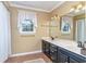 Bathroom featuring a light countertop, dark cabinetry, and a neutral-colored shower curtain at 128 Causey St., Myrtle Beach, SC 29577
