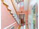 Inviting foyer with a staircase, hardwood floors, and decorative lighting fixtures at 128 Causey St., Myrtle Beach, SC 29577