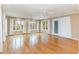 Bright living room features hardwood floors, recessed lighting, ceiling fans, and three large windows at 128 Causey St., Myrtle Beach, SC 29577