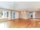 Bright living room with hardwood floors, recessed lighting, ceiling fans, and glass doors to the outside at 128 Causey St., Myrtle Beach, SC 29577