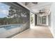 Relaxing screened-in porch with a view of the sparkling pool and backyard oasis, perfect for outdoor living at 128 Causey St., Myrtle Beach, SC 29577