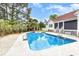 Refreshing swimming pool with a spacious deck surrounded by lush landscaping, ideal for entertaining at 128 Causey St., Myrtle Beach, SC 29577