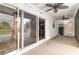 Enclosed porch featuring multiple sliding glass doors and ceiling fans at 128 Causey St., Myrtle Beach, SC 29577