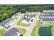 Aerial view of townhome community with street, parking, and lawns, surrounded by trees at 136 Villa Grande St. # B, Myrtle Beach, SC 29579