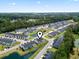 Wide aerial view of a townhome community with pond and wooded area at 136 Villa Grande St. # B, Myrtle Beach, SC 29579
