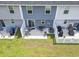 Aerial view of townhome backyards with patio spaces and green grass at 136 Villa Grande St. # B, Myrtle Beach, SC 29579