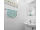 Bathroom featuring a pedestal sink, modern faucet, and decorative towel rack at 136 Villa Grande St. # B, Myrtle Beach, SC 29579