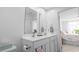 Bright bathroom featuring double sinks, white cabinets and a modern design at 136 Villa Grande St. # B, Myrtle Beach, SC 29579