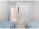 Cozy bedroom showcasing twin beds with blue bedding and white walls at 136 Villa Grande St. # B, Myrtle Beach, SC 29579