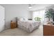 Cozy bedroom with natural light, large window, floral bedding, and hardwood furniture at 136 Villa Grande St. # B, Myrtle Beach, SC 29579