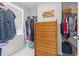 Walk-in closet with shelving, hanging racks, blinds, and a wooden dresser at 136 Villa Grande St. # B, Myrtle Beach, SC 29579