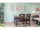 Dining room with rustic wooden table, cushioned chairs, and decoratively adorned walls at 136 Villa Grande St. # B, Myrtle Beach, SC 29579