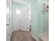 Hallway that reveals the interior spaces of a residential home including a half bathroom at 136 Villa Grande St. # B, Myrtle Beach, SC 29579