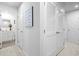 Hallway with white doors, louvered closet, and access to a bathroom at 136 Villa Grande St. # B, Myrtle Beach, SC 29579