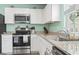 Charming kitchen featuring stainless steel appliances and ample storage space at 136 Villa Grande St. # B, Myrtle Beach, SC 29579