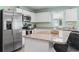 Stylish kitchen with stainless steel appliances, granite countertops, and an island with seating at 136 Villa Grande St. # B, Myrtle Beach, SC 29579