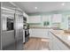 Modern kitchen featuring stainless steel appliances, granite countertops, and ample cabinet space at 136 Villa Grande St. # B, Myrtle Beach, SC 29579