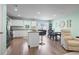 An expansive view into the residence featuring an open kitchen, breakfast nook, and living space at 136 Villa Grande St. # B, Myrtle Beach, SC 29579