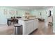 Open concept living area flowing from kitchen island with a view into the sitting and dining areas at 136 Villa Grande St. # B, Myrtle Beach, SC 29579