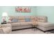 Comfortable living area features a sectional sofa with throw pillows, a small table, and area rug at 136 Villa Grande St. # B, Myrtle Beach, SC 29579