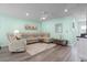 Inviting living room with plush sectional sofa, modern ceiling fan and light, and stylish decor at 136 Villa Grande St. # B, Myrtle Beach, SC 29579