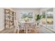 Bright dining area with a round table, stylish chairs, and natural light from sliding glass doors at 152 Ashworth Dr., Tabor City, NC 28463