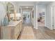Inviting entryway with wood flooring, decorative cabinet, and views into other rooms at 152 Ashworth Dr., Tabor City, NC 28463
