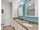 Double sink bathroom with granite counters and shower at 1581 S Waccamaw Dr. # 302, Garden City Beach, SC 29576